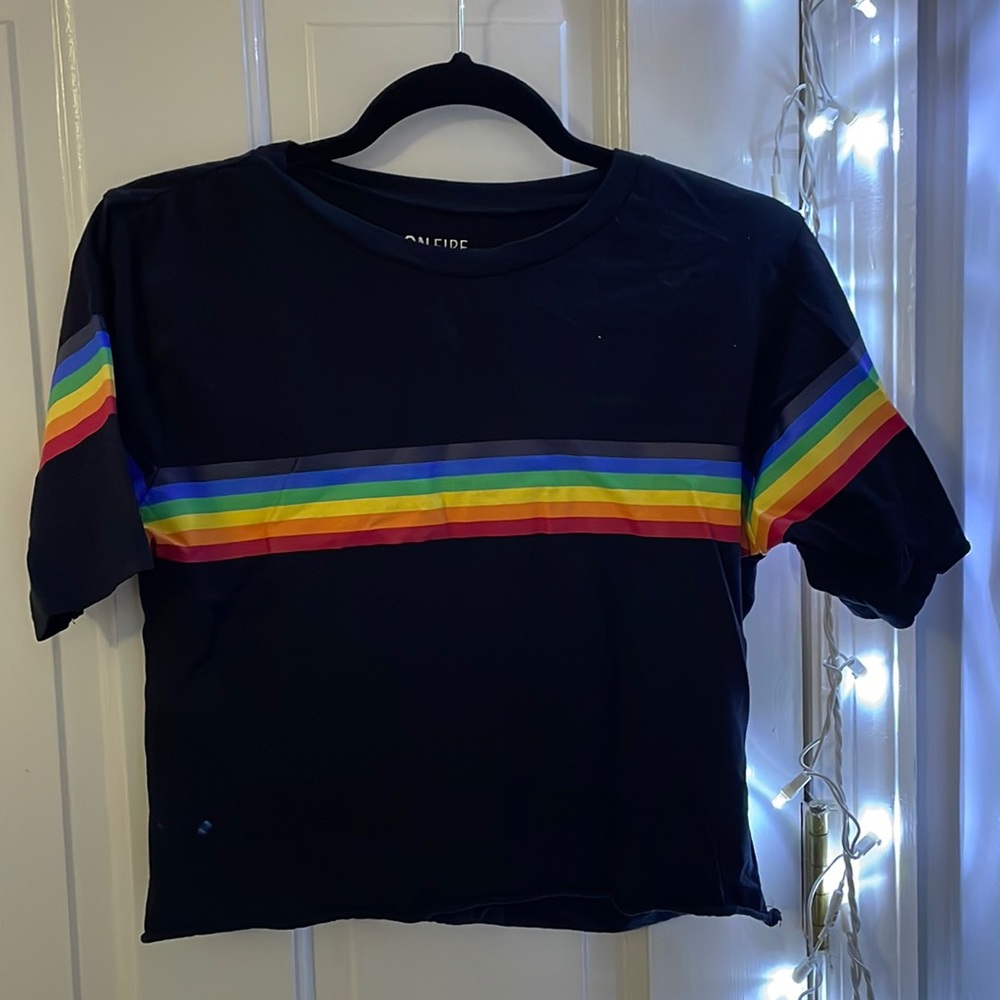 Black shirt with rainbow stripes. I’ve never worn it but I took the tags off.